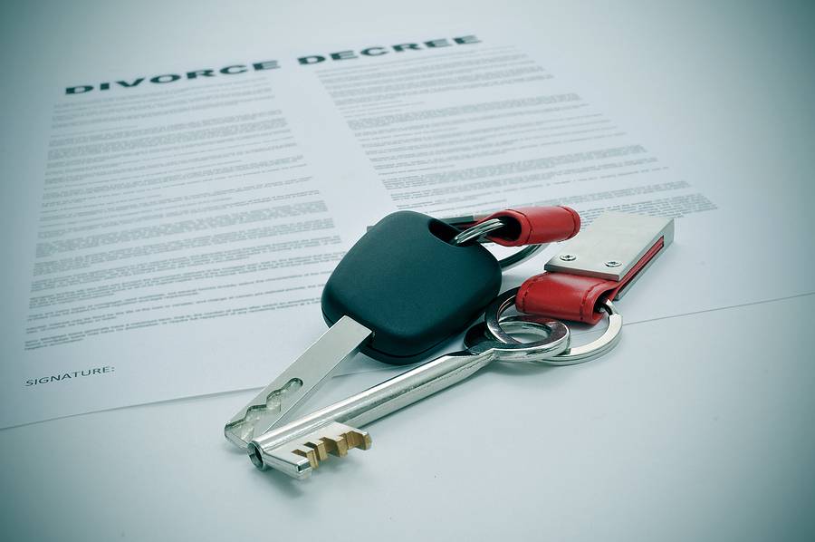 Proving Property Rights During a Non-Traditional Marriage Divorce - a divorce decree document and the keys of a car and a house
