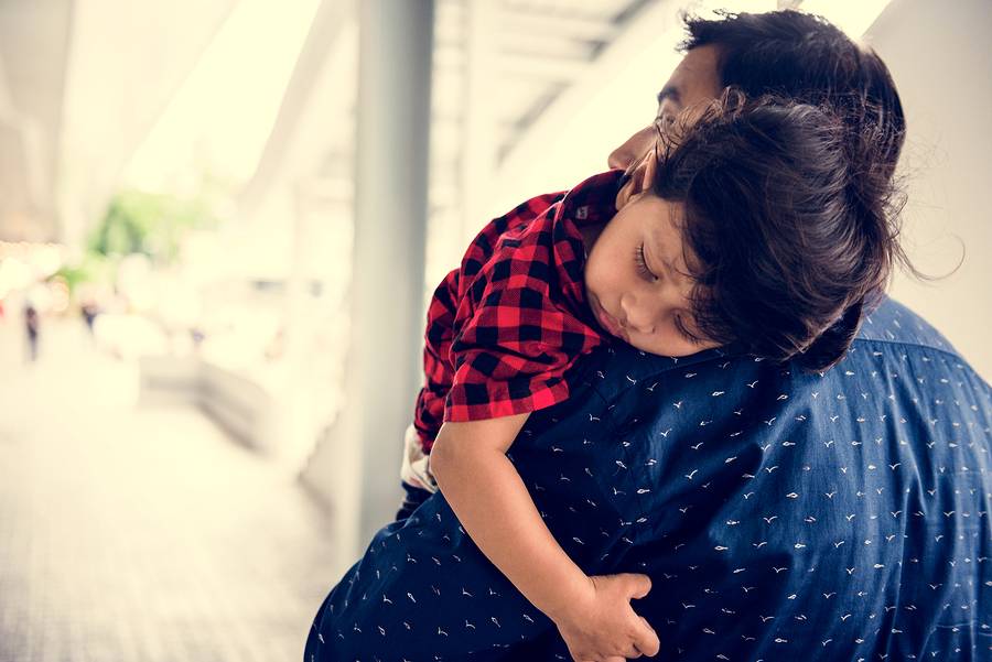 father and son hugging eachother after paternity testing and child custody issues.