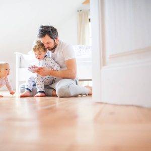 father playing with his two children