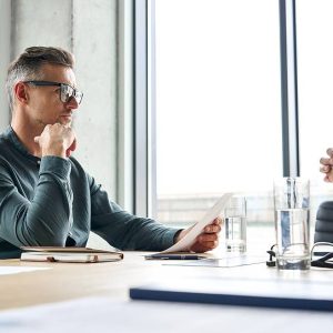 lawyer talking with client about how paternity affects child inheritance