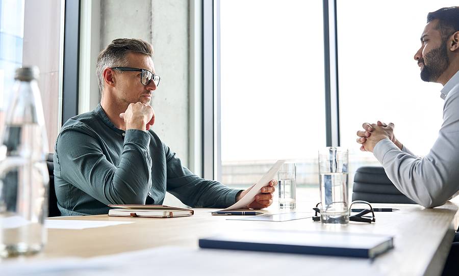 lawyer talking with client about how paternity affects child inheritance