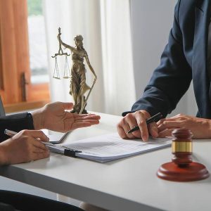 lawyer talking with client about how owning a business can affect child support