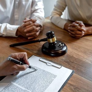 couple with a lawyer discussing about paternity and parental rights